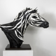 Image for article titled This Artist Turns Old Tires Into Dark, Disturbing Nightmare Monsters